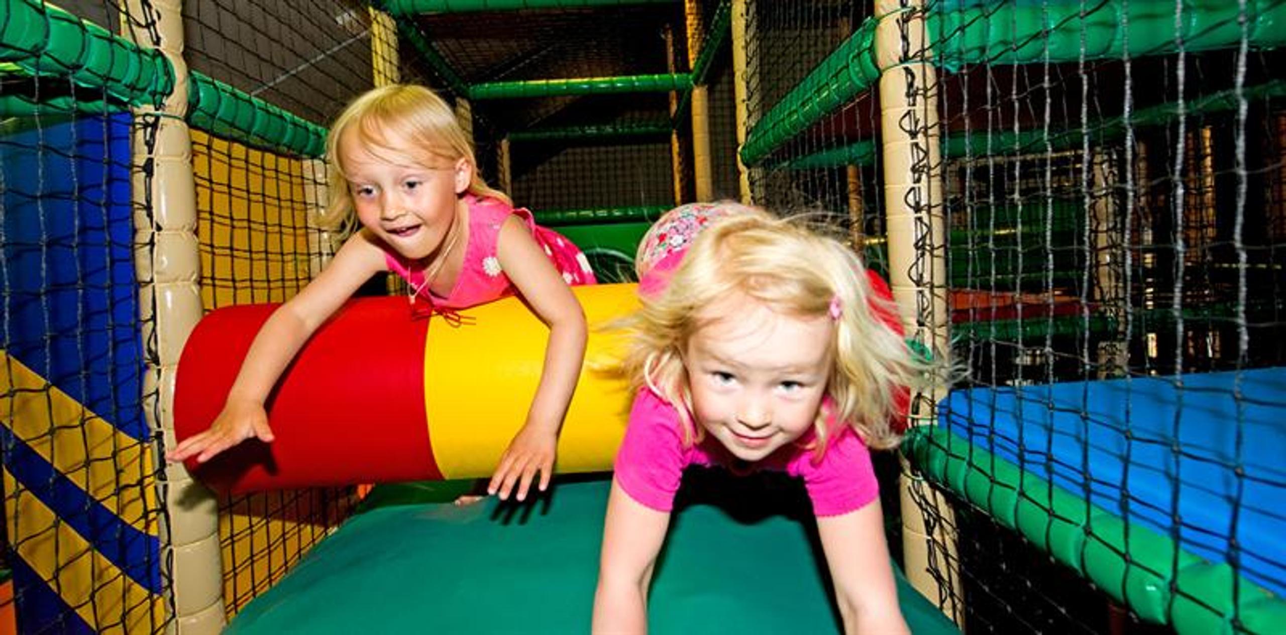 Children have fun ar the playground. 