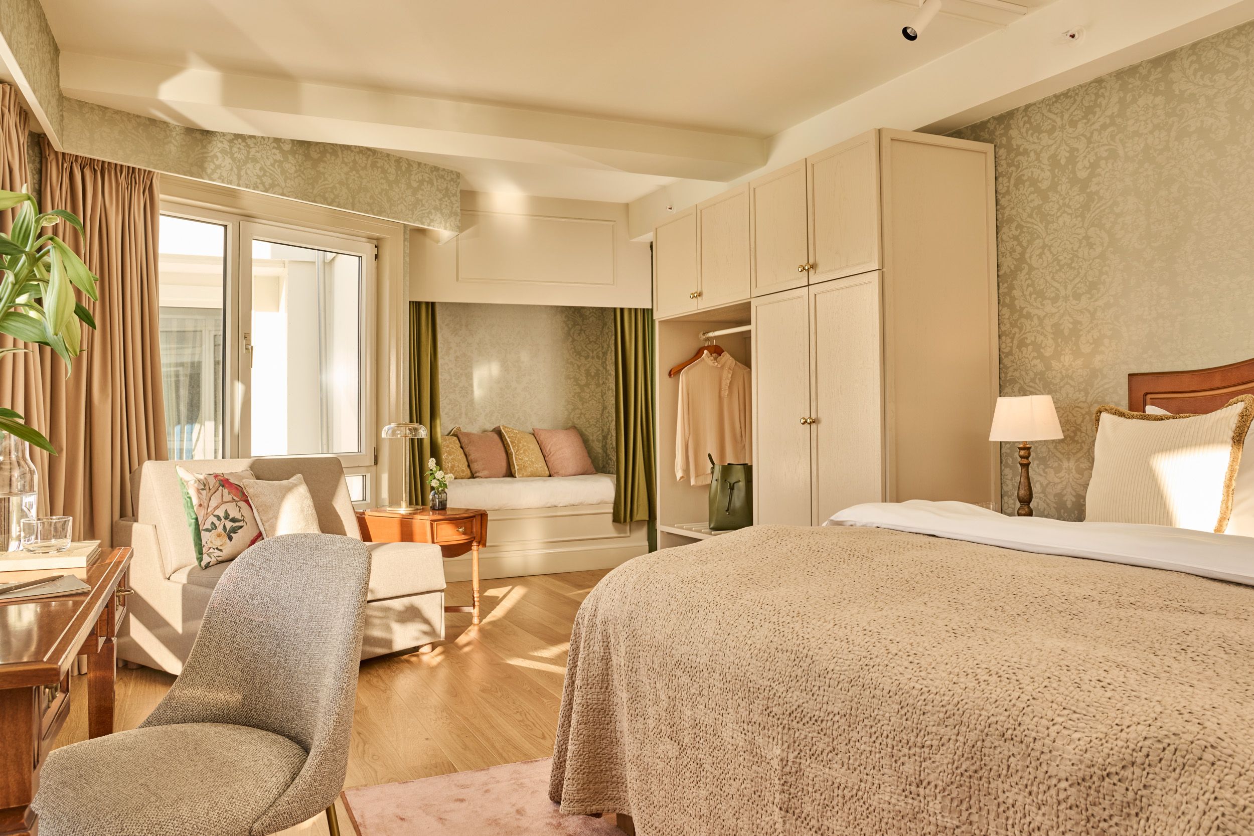 Bright and elegant hotel room at Hotel Ullensvang in Lofthus, featuring timeless design and cozy comfort.