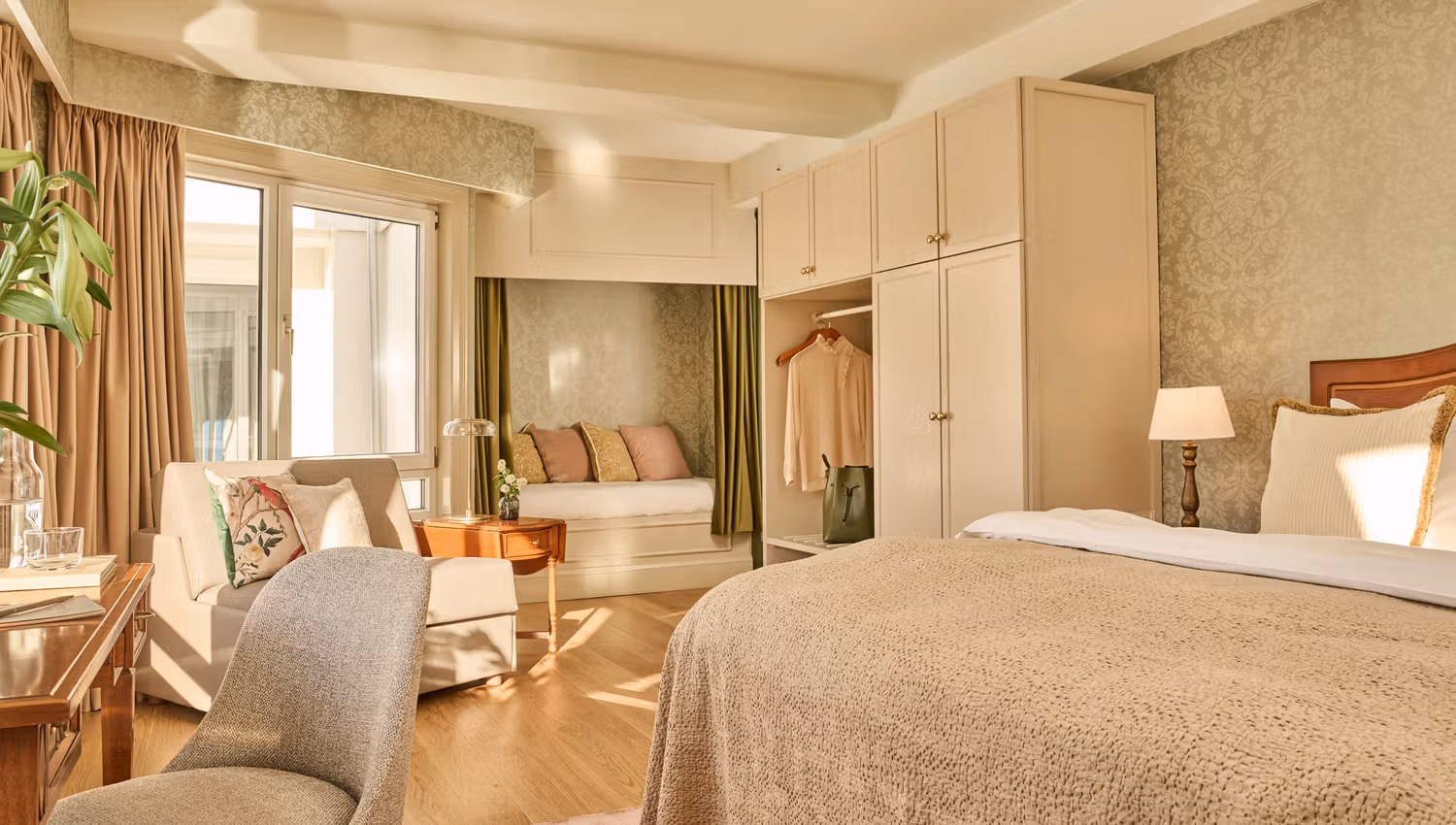 Bright and elegant hotel room at Hotel Ullensvang in Lofthus, featuring timeless design and cozy comfort.