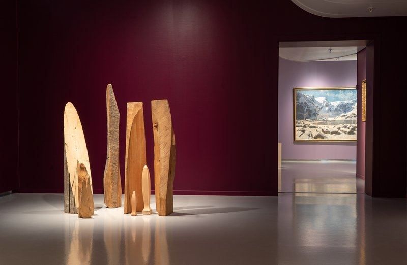 Wooden installation on the floor with a doorway revealing an image