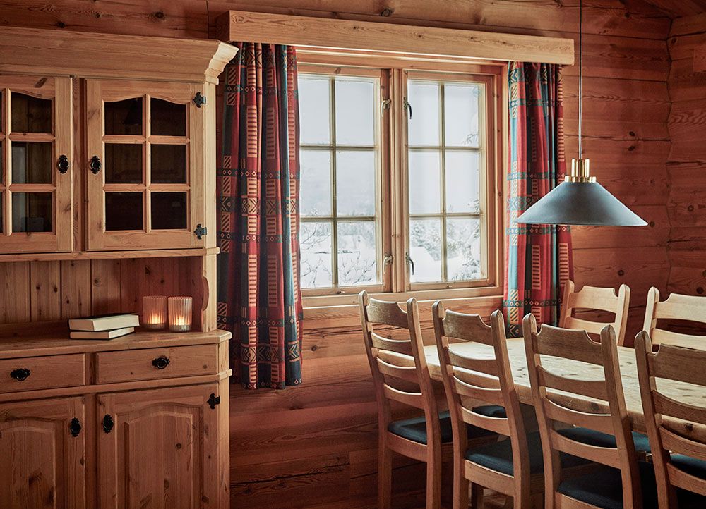 dining table by the window at the cottage at Gaustablikk Fjellresort