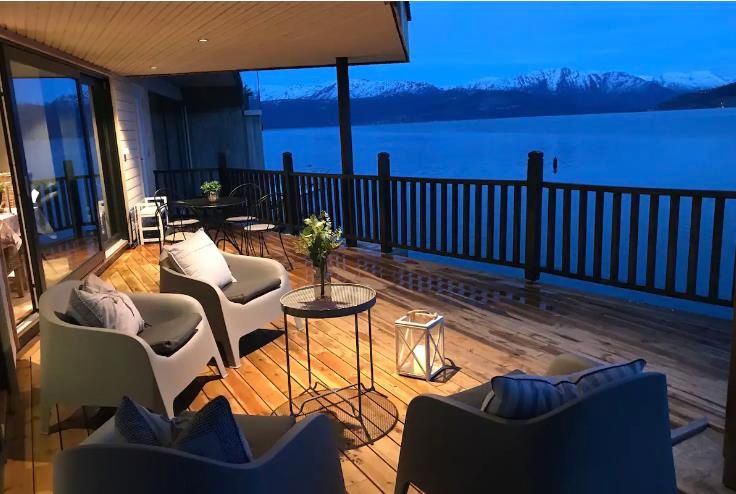 Evening ambiance on the beautiful terrace overlooking the Hardangerfjord. Perfect for peaceful nights surrounded by nature.
