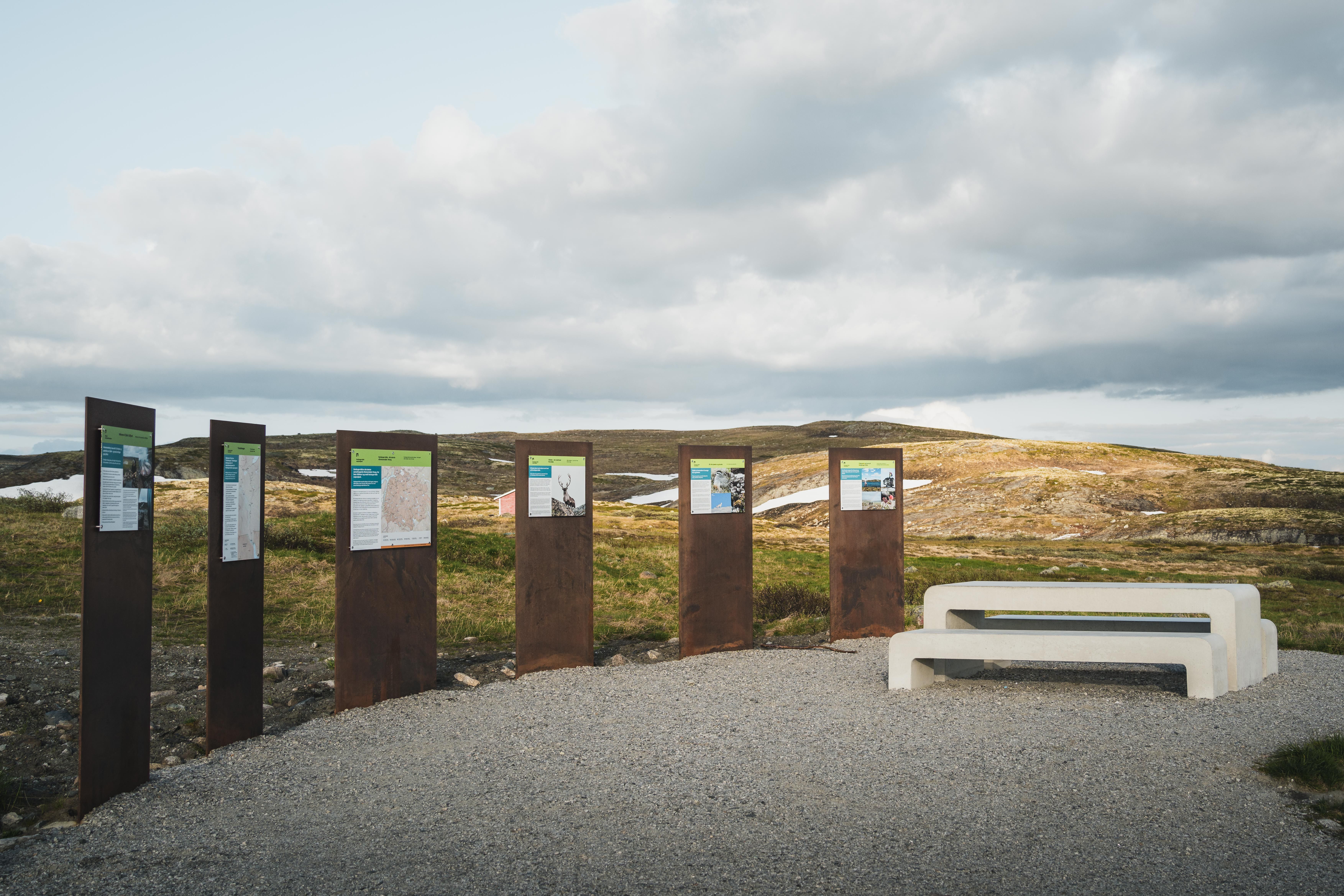 Information boards and benches and tables at Tråastølen.