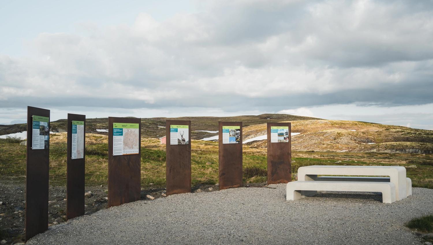 Information boards and benches and tables at Tråastølen.