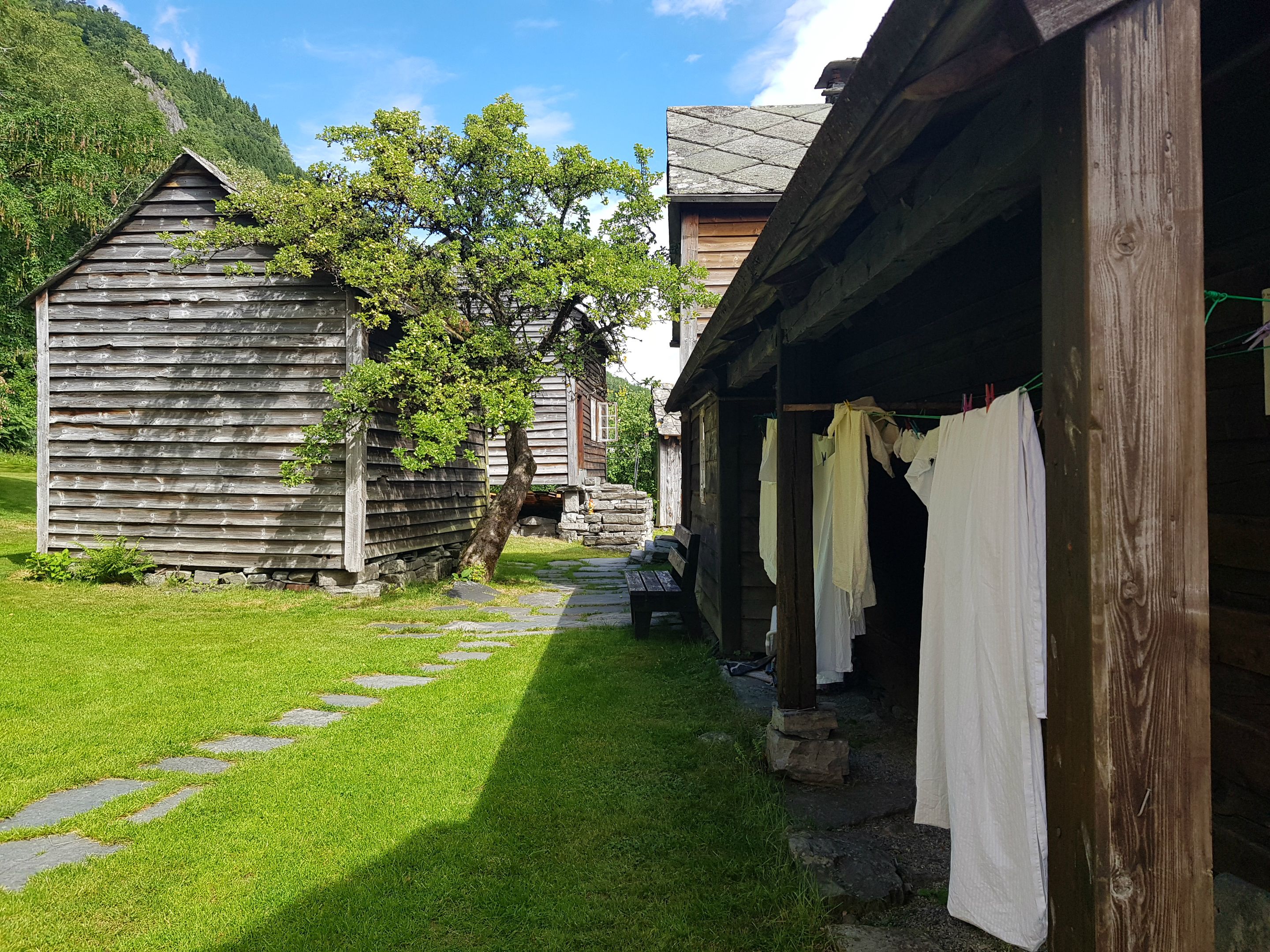 clothes are drying outside by the old houses 