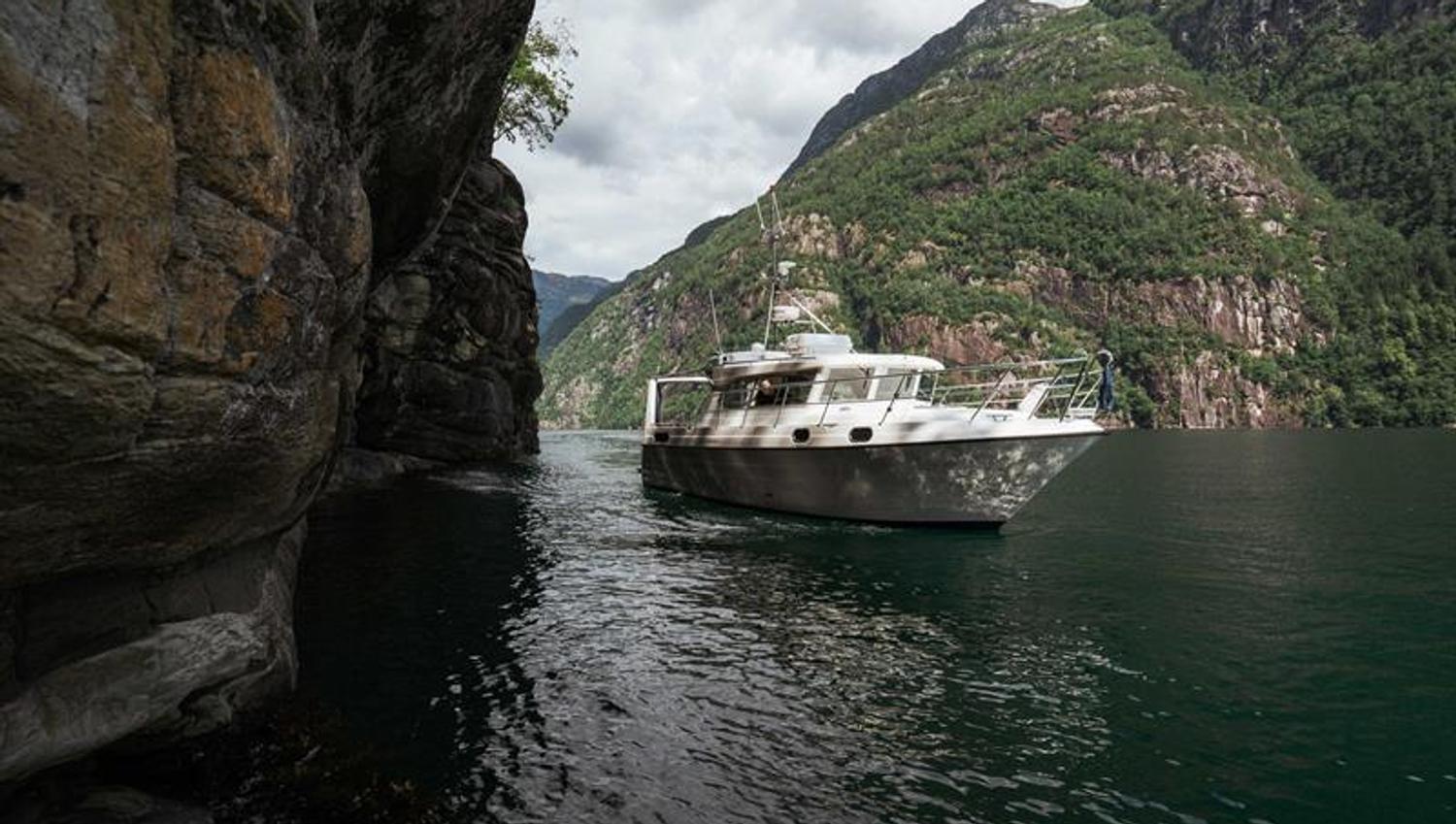 Pilagutt in a spectacular fjord corridor, surrounded by steep mountain walls and untouched nature – an adventurous fjord journey.