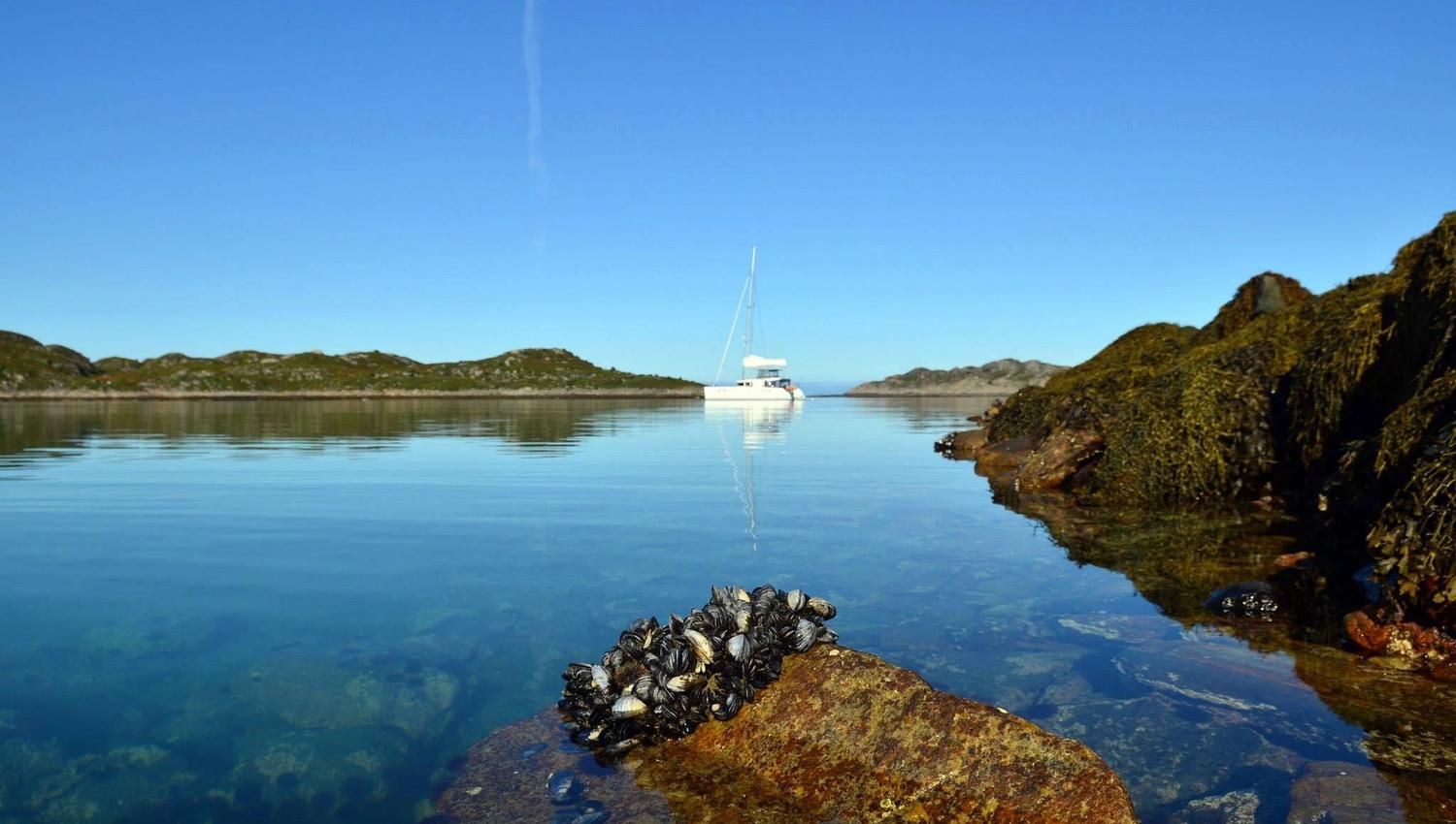 View from shore out to sailboat
