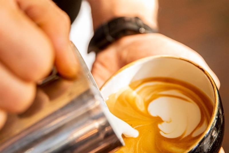 Detail of cappuccino being prepared.