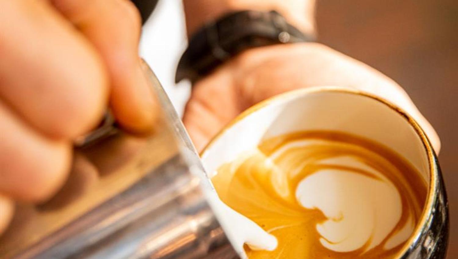 Detail of cappuccino being prepared.
