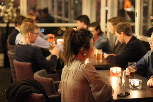 Guests sitting in Toppen bar