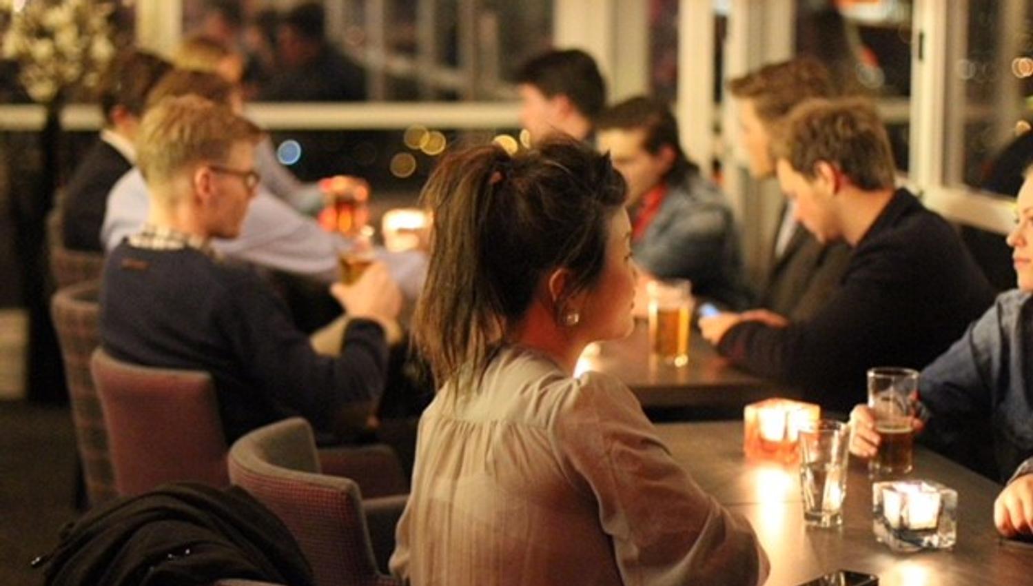 Guests sitting in Toppen bar