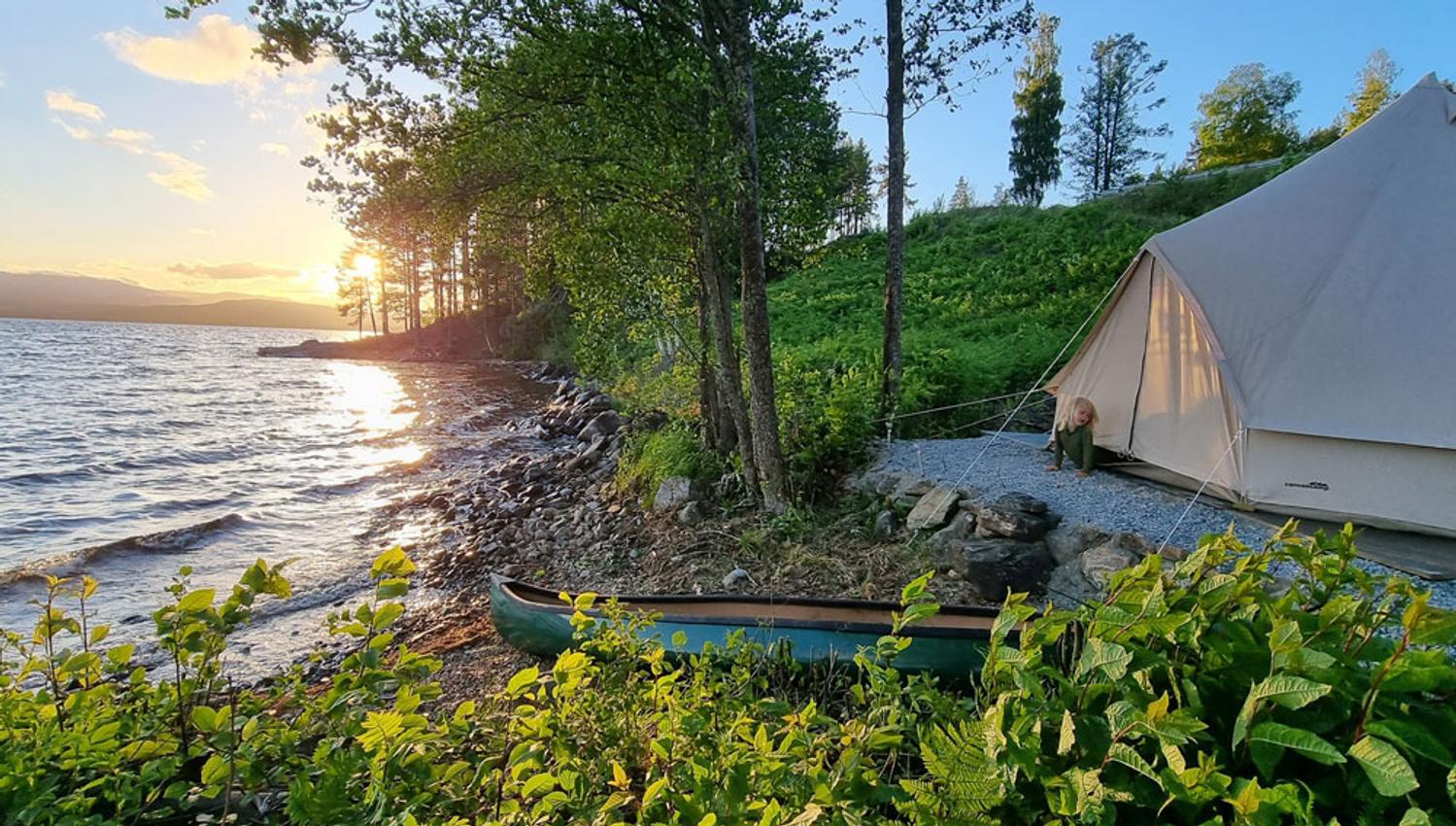 glamping tent at Bolkesjø Gard which is located right by the water