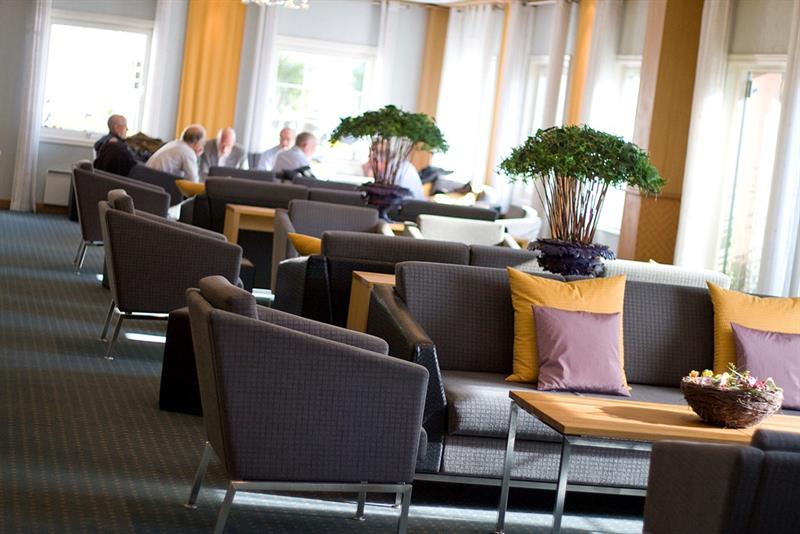 chairs and table in a big room for relaxing