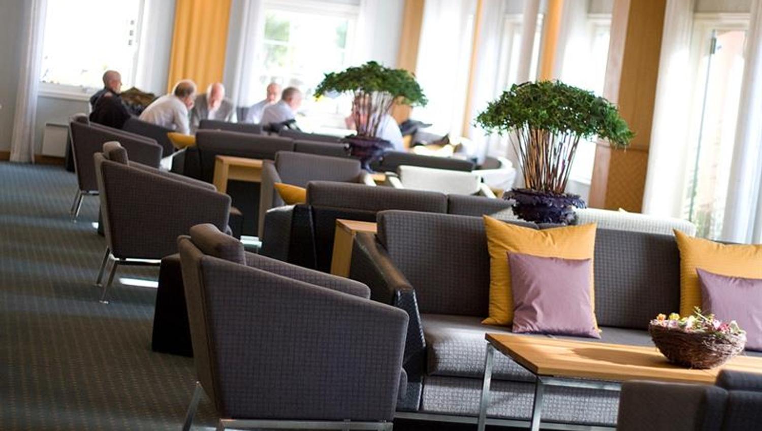 chairs and table in a big room for relaxing