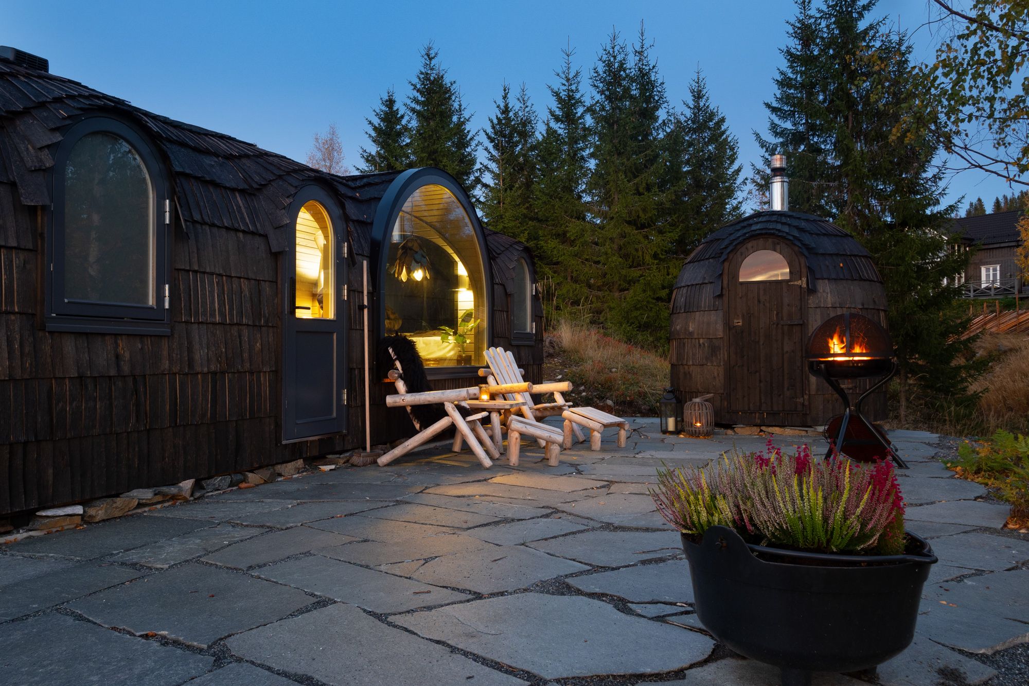 the cabins with a bonfire outside 