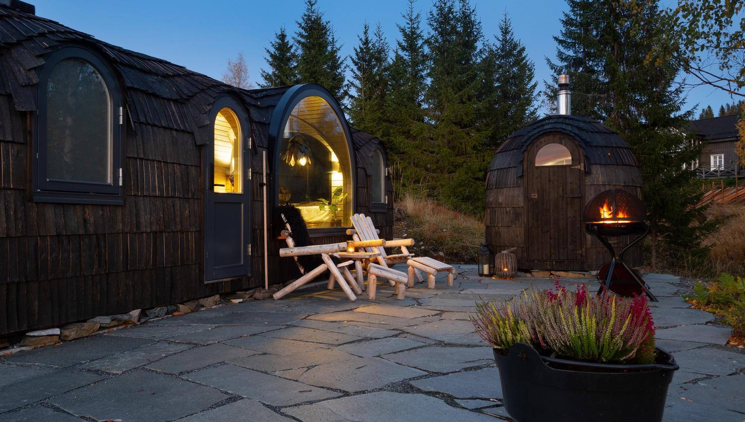 the cabins with a bonfire outside