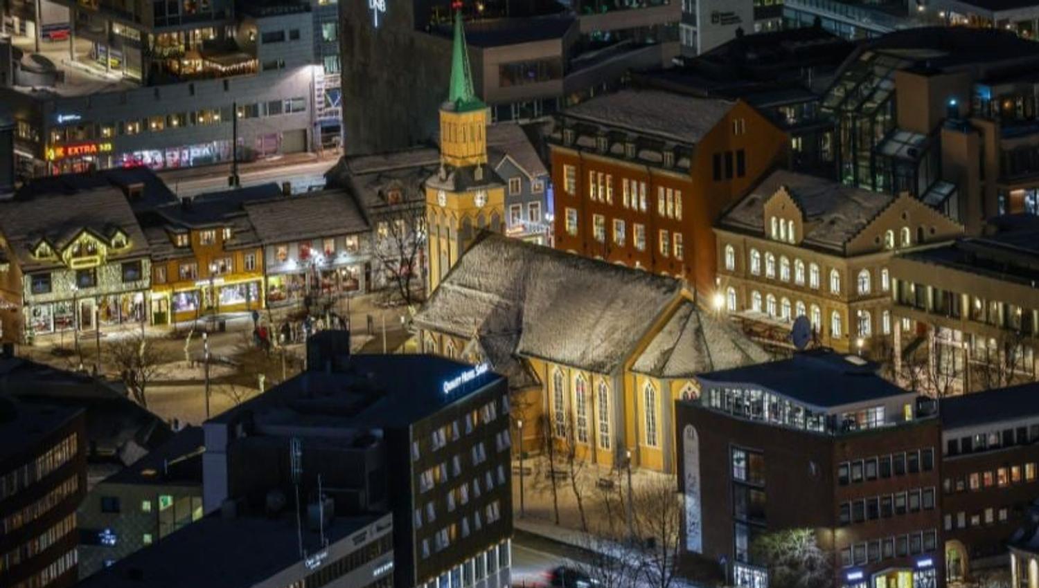 Evening view over Tromsø city centre, part of the area explored during the historical walking tour.