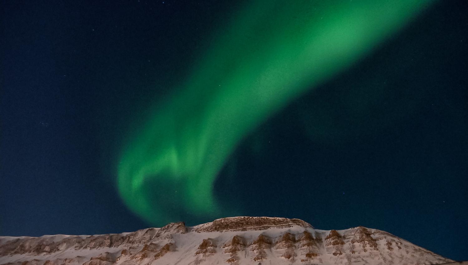 Northern lights above the mountain