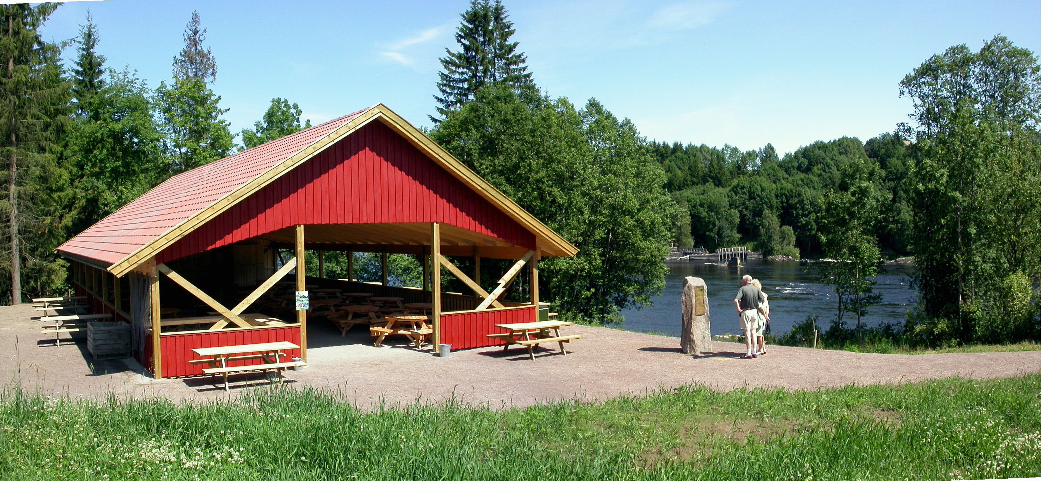 A red stilt house by the waterfall
