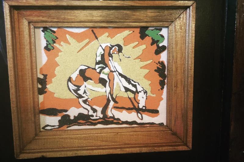 Detalj av maleri med en rytter på en hest