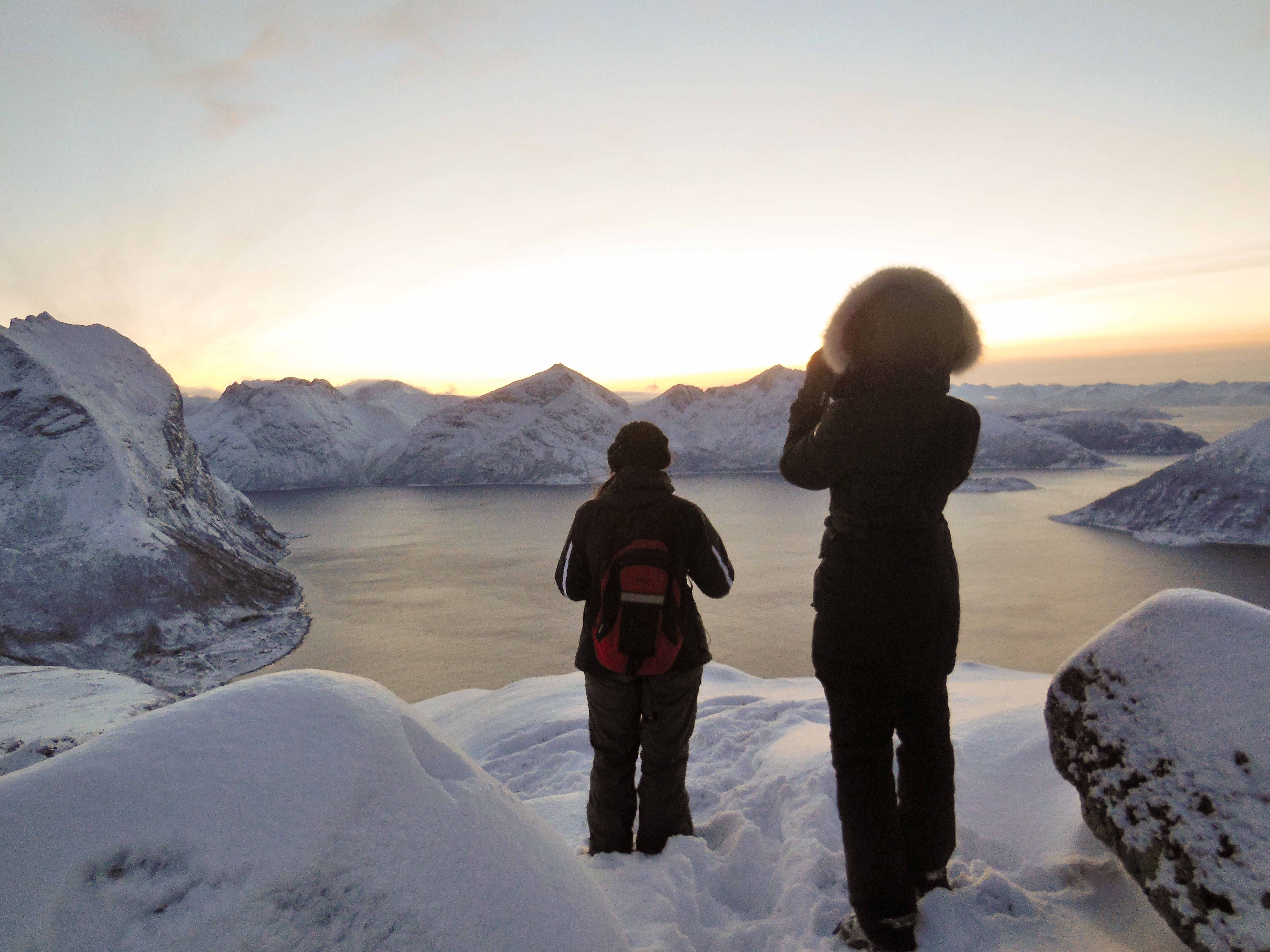Two guests taking pictures of the view