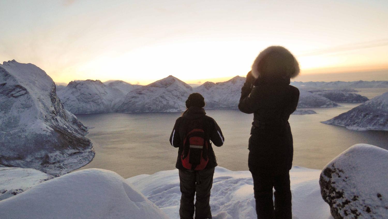 Two guests taking pictures of the view