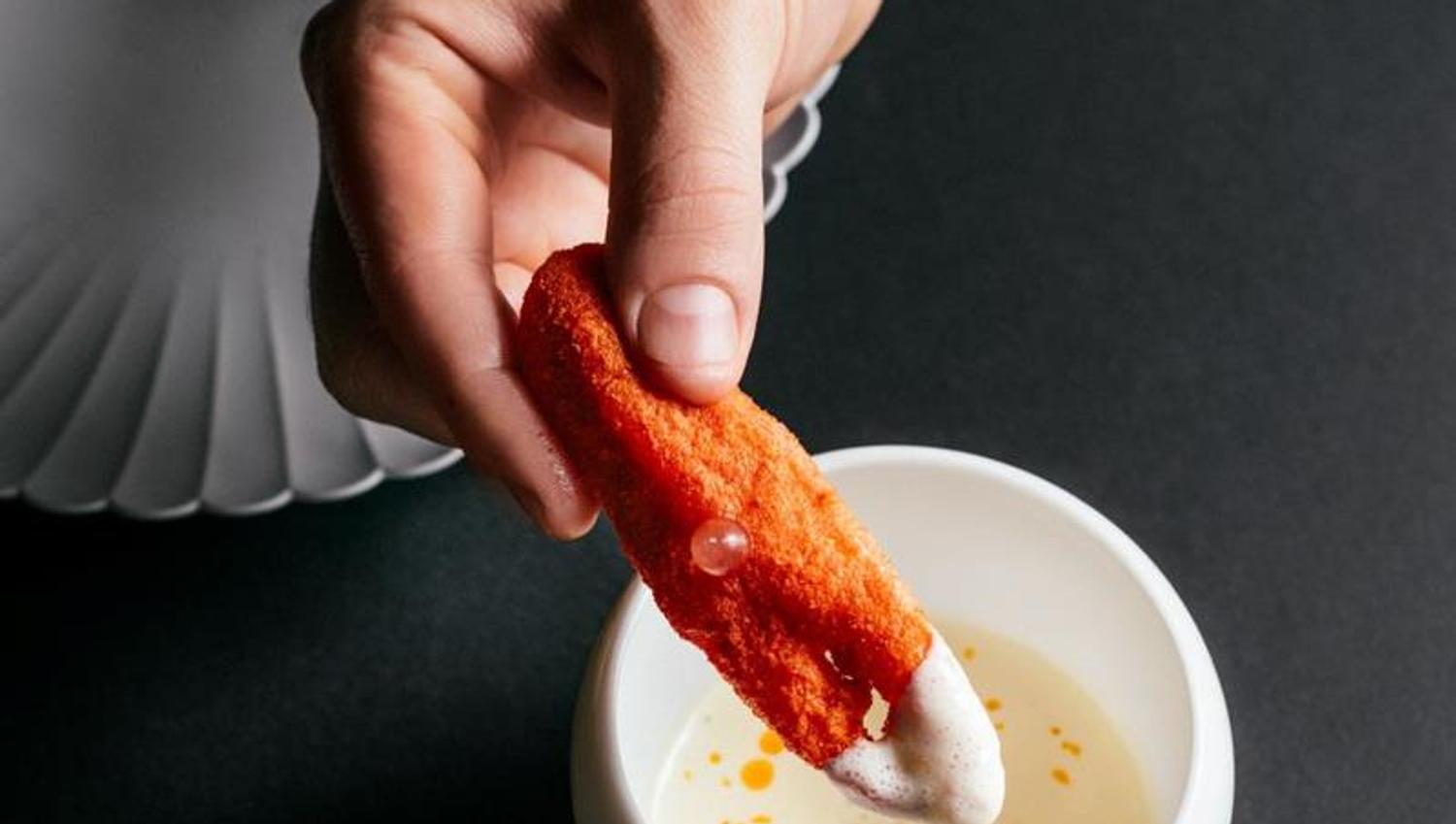chef dipping a dish
