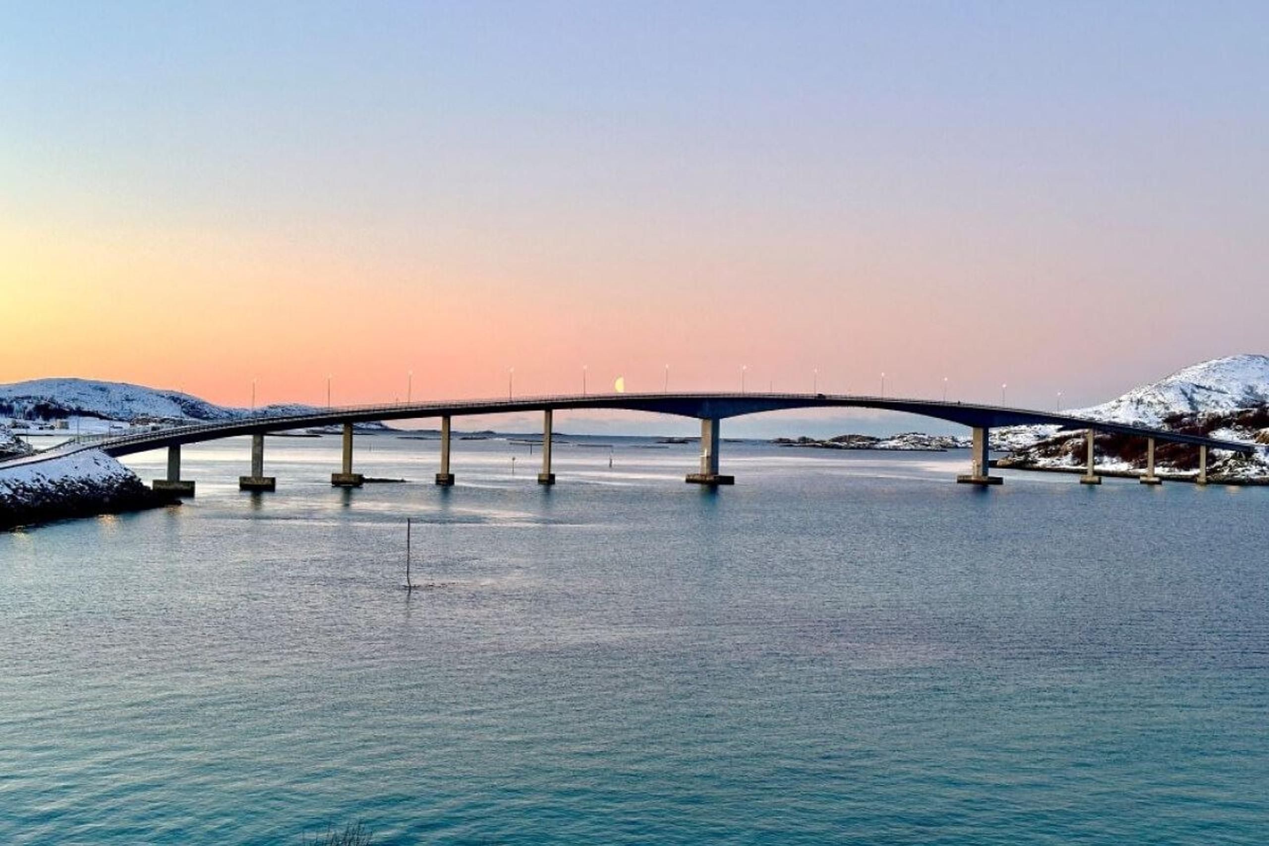 The bridge to Sommarøy with the sunset in the background