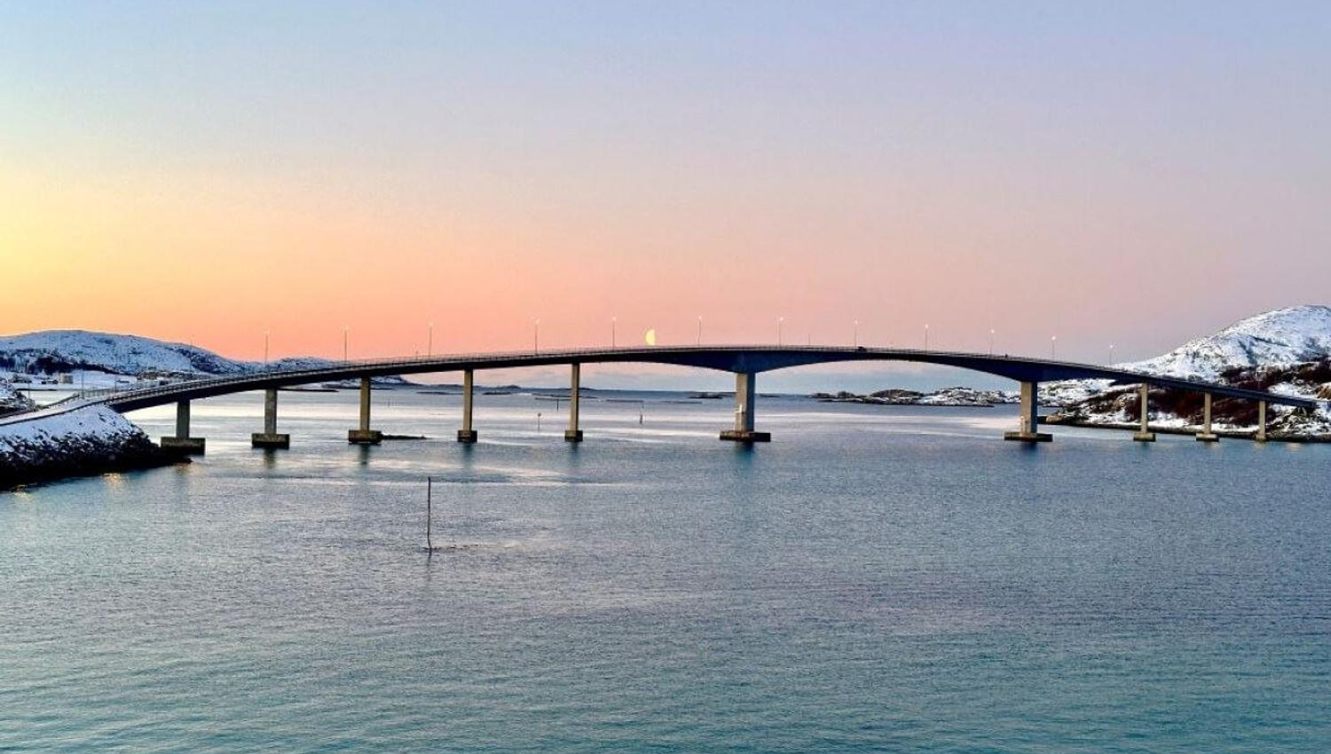 The bridge to Sommarøy with the sunset in the background