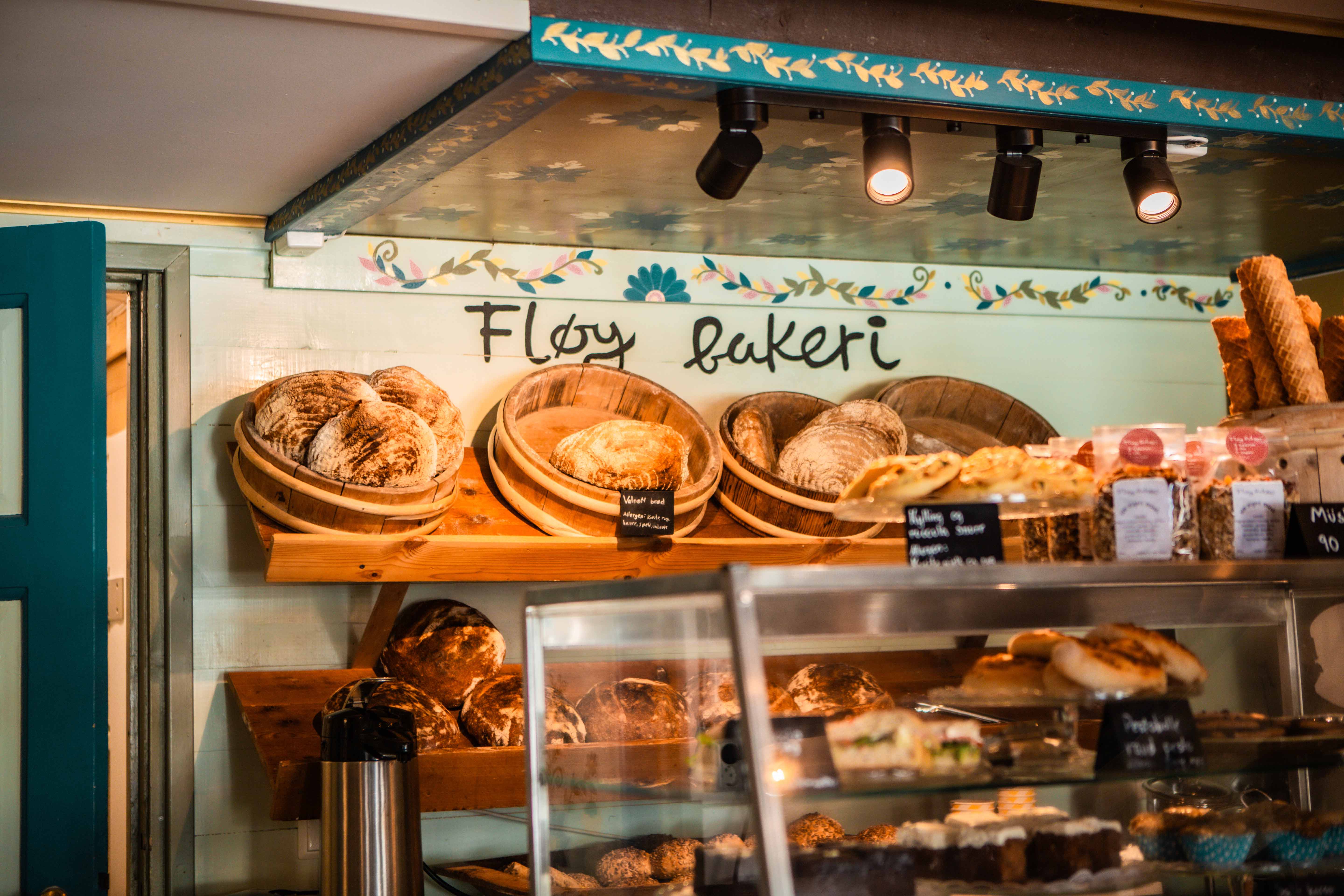 Fresh baked goods behind the counter at the charming Fløy Bakery in Lofthus.