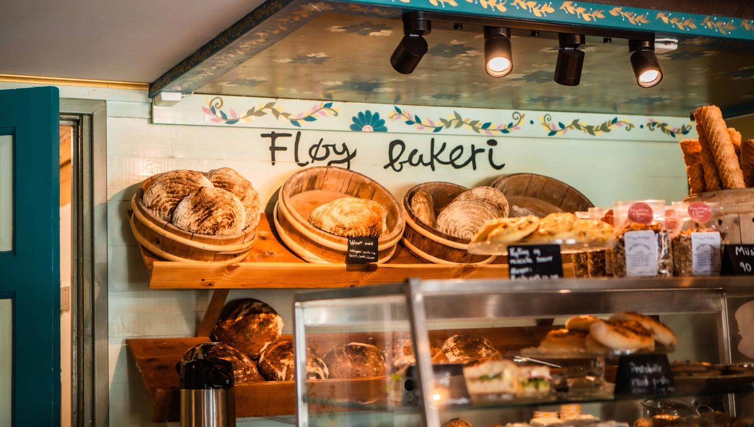 Fresh baked goods behind the counter at the charming Fløy Bakery in Lofthus.