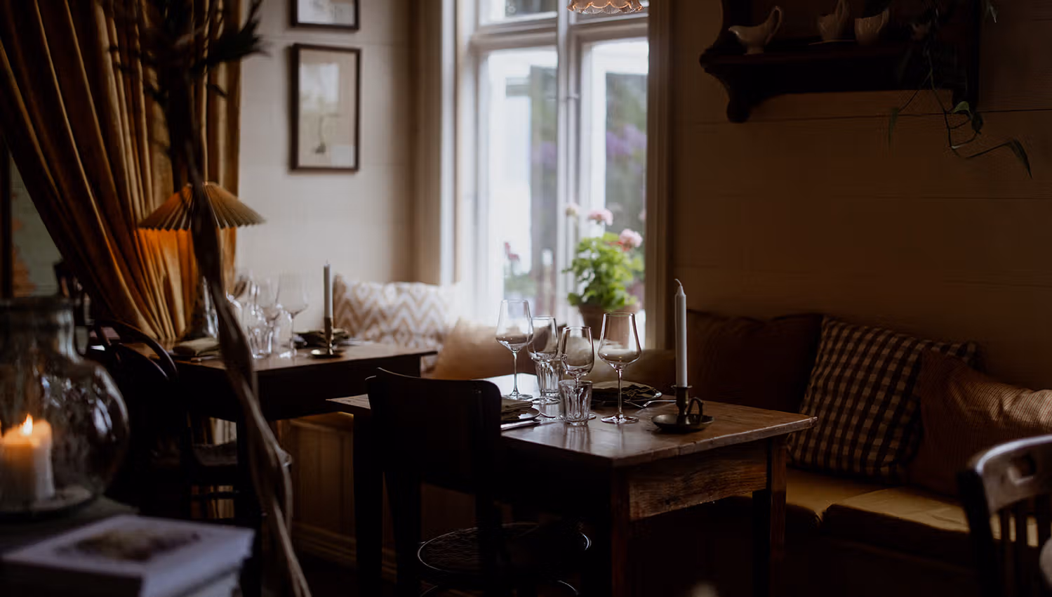 Charming dining spot at Hotel Sundal – offering a cozy vibe and views of the fjord garden.