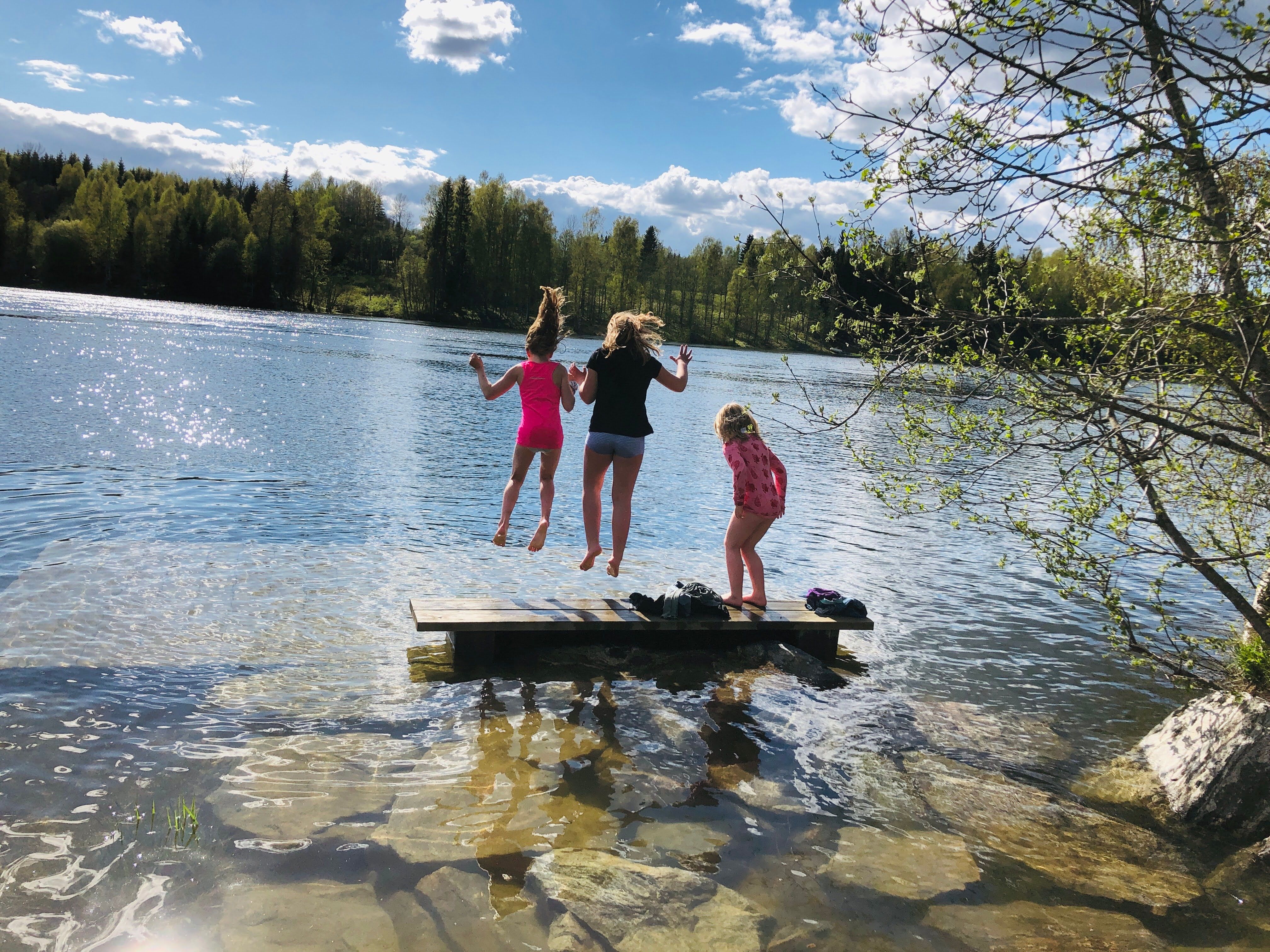 Girls jumping into the sea 