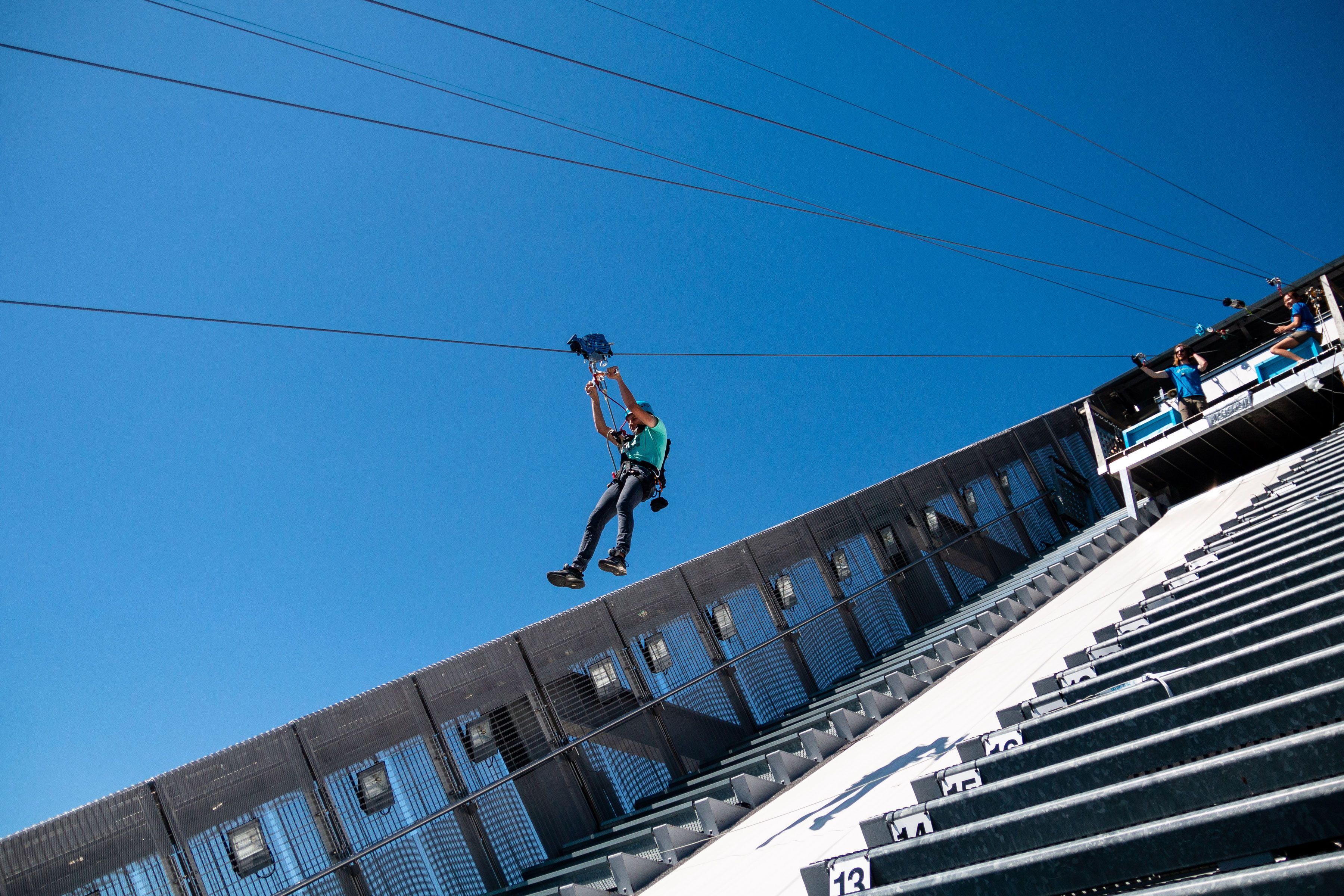 Person ziplining down Holmenkollen Ski Jump.
