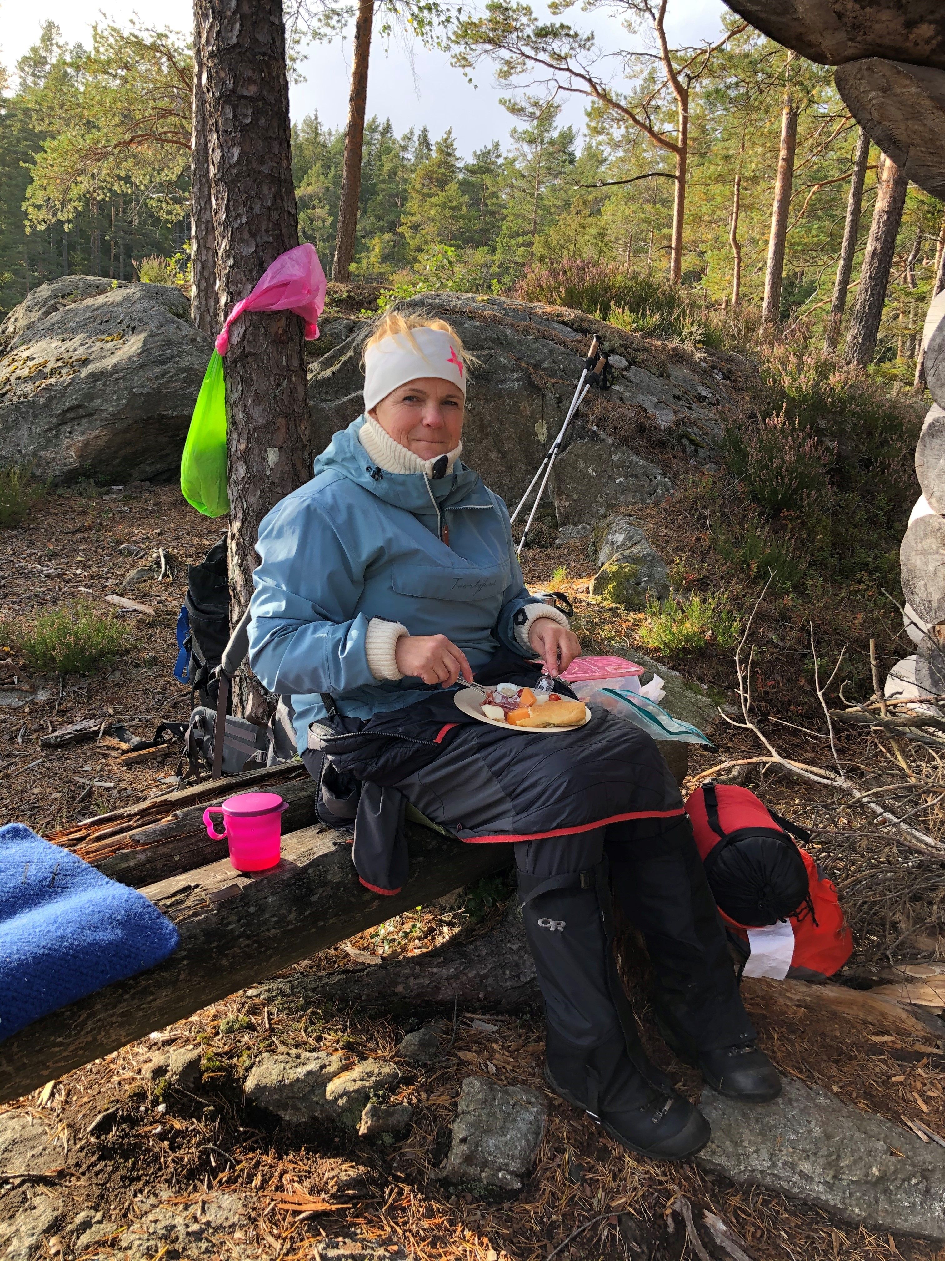 Woman eating in woods