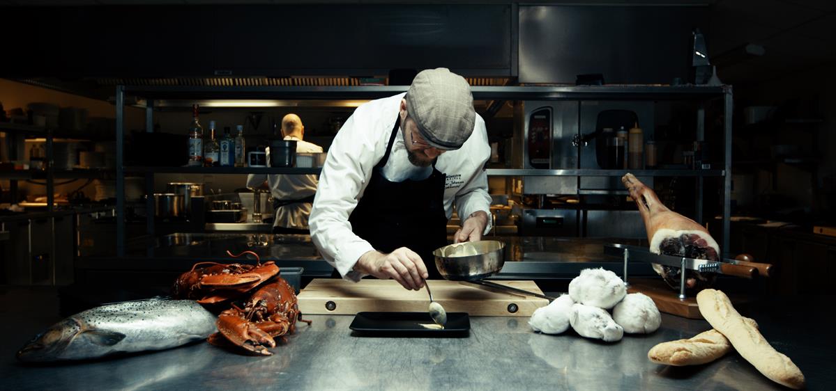 The chef plates up a dish at Pellestova Restaurant