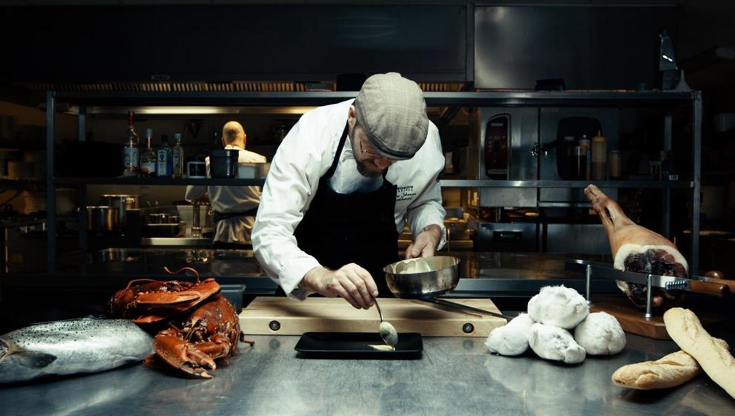 The chef plates up a dish at Pellestova Restaurant