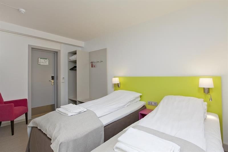 double room with two single beds and wardrobe