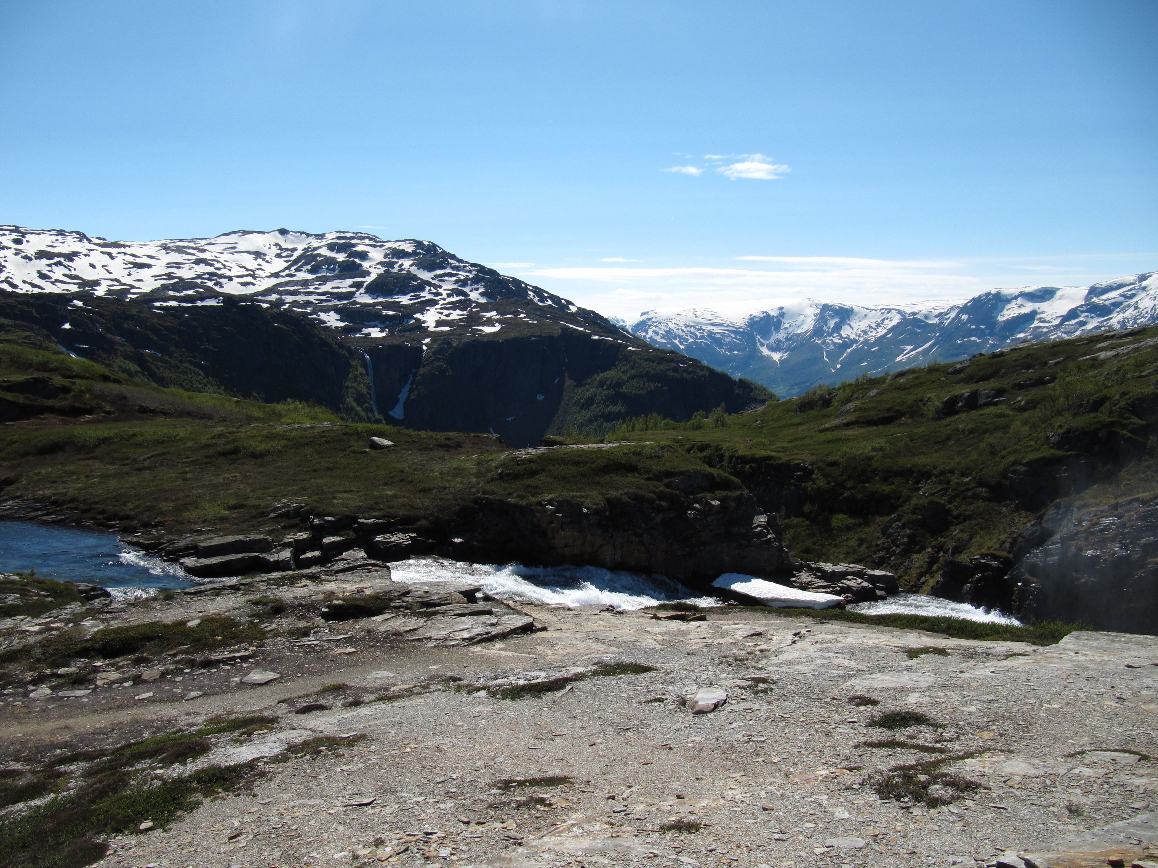 River and waterfall at the top of the Monk’s Steps with panoramic views of mountains and glaciers in Hardanger.