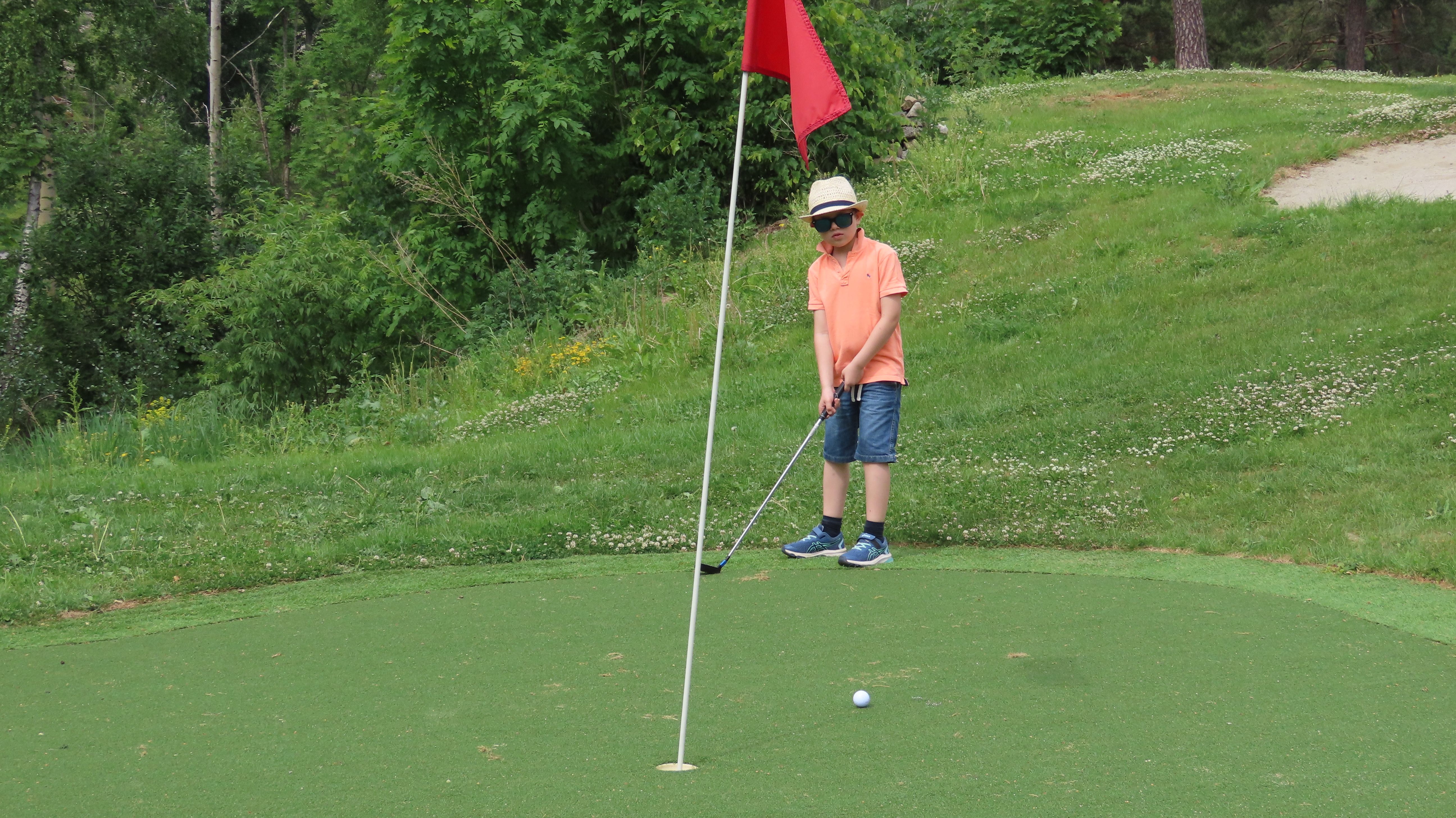 Boy playing golf