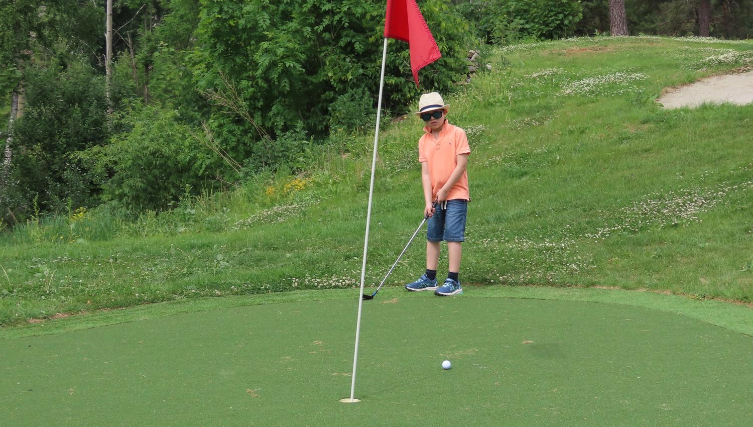 Boy playing golf