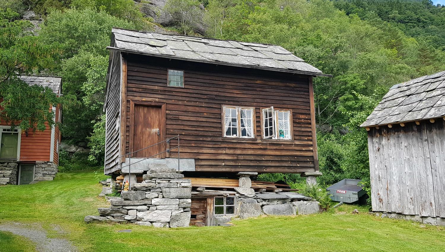 older house standing by itself. The window is open.