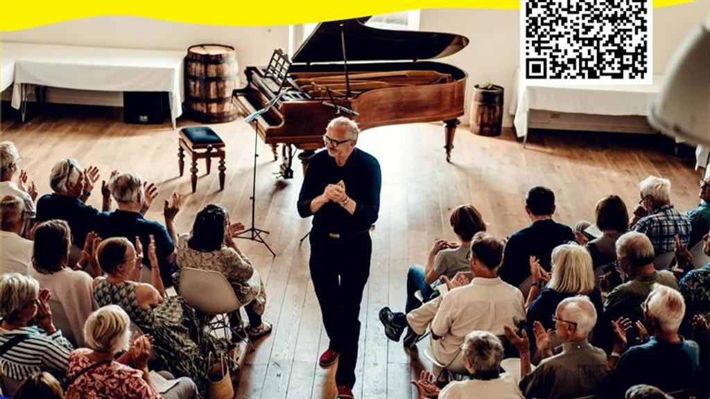 A concert hall with an applauding audience  