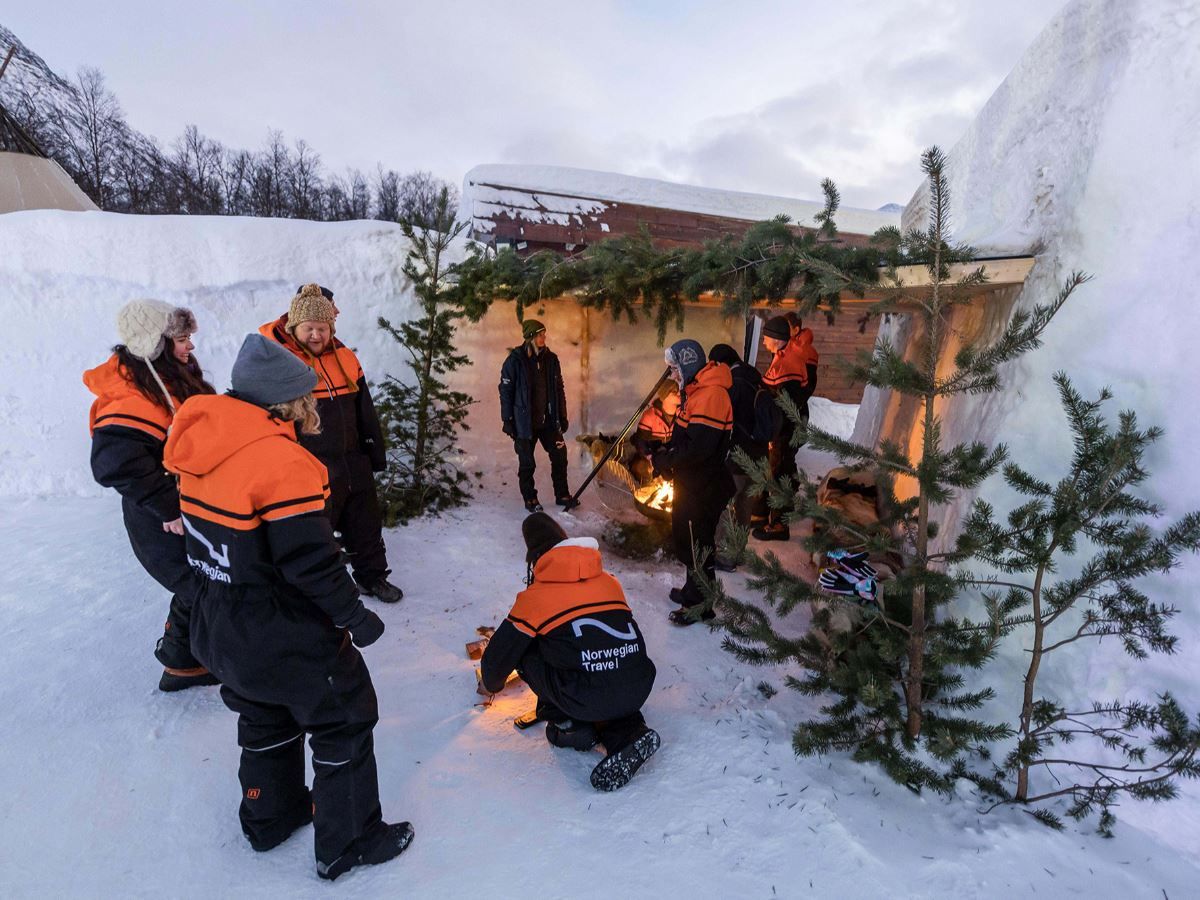 Guests try lighting the fire on their own