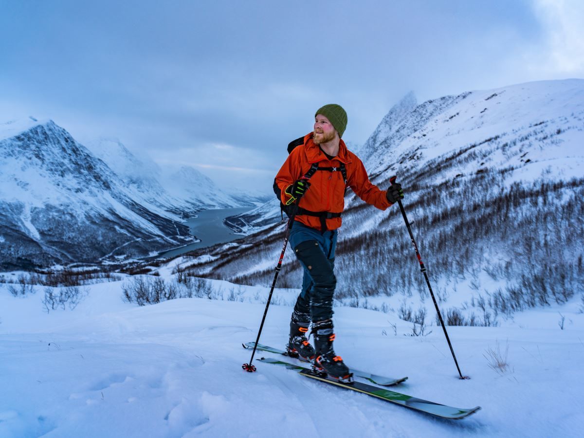 One person skiing up a mountain