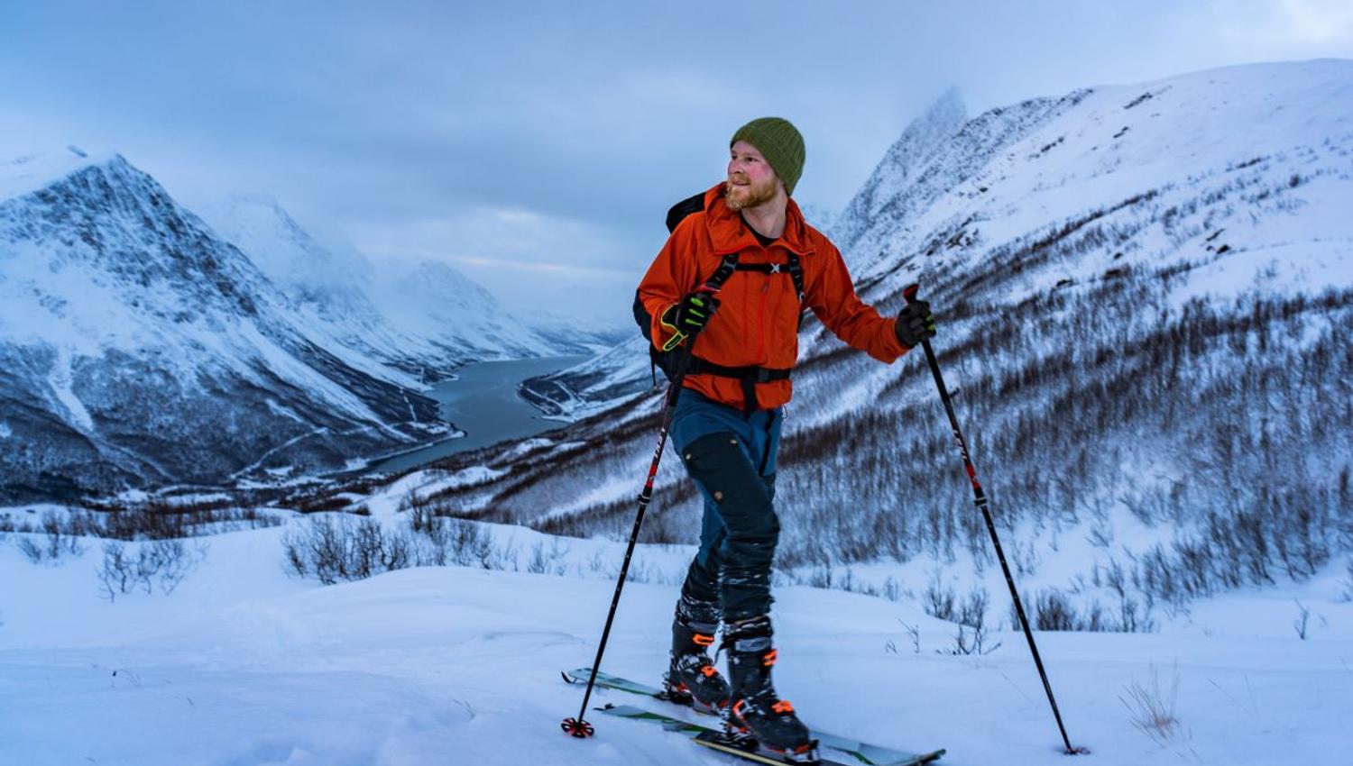 One person skiing up a mountain