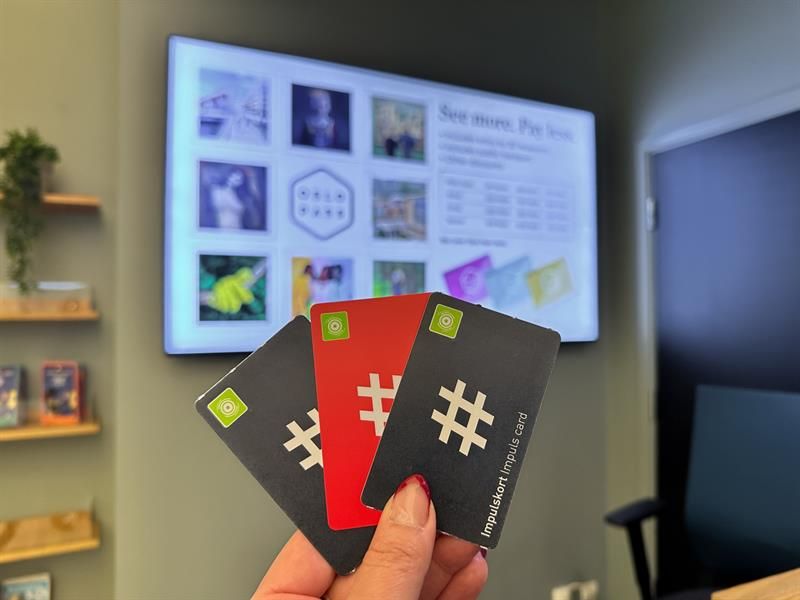 Detail of a hand holding three public transport tickets