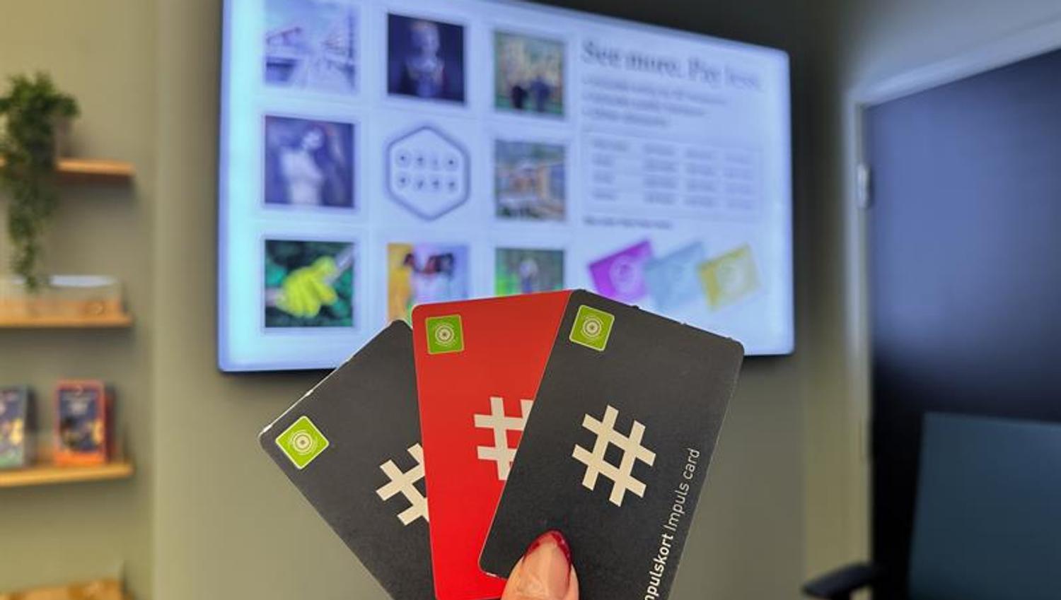 Detail of a hand holding three public transport tickets