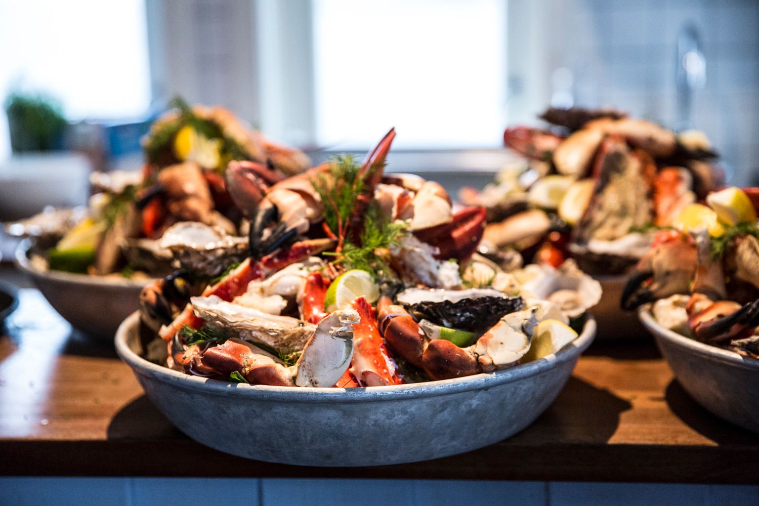Detail photo of bowls with an assortment of seafood.