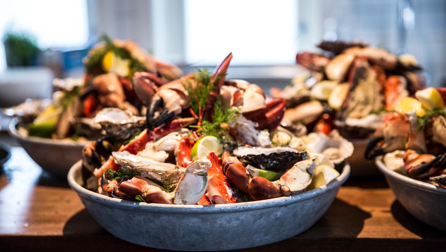 Detail photo of bowls with an assortment of seafood.